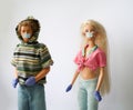 GUADALAJARA, SPAIN - MAY 14, 2020: Barbie and Ken are wearing protective face masks and gloves against the coronavirus disease