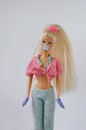 GUADALAJARA, SPAIN - MAY 14, 2020: Barbie is wearing protective face mask and gloves for prevention of spreading COVID-19 pandemic
