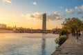 Guadalquivir River and Sevilla Tower (Torre Sevilla) at Sunset - Seville, Spain