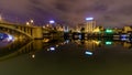 Guadalquivir river of Seville, night scene with lights in the city and reflections in the calm water, panoramic cityscape Royalty Free Stock Photo