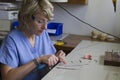 Guadalupe, Ecuador - May 27, 2014: Dental technician works on dentures