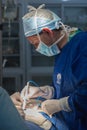 Doctor probes abdomen during surgery