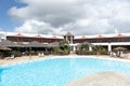 Relaxing scenery at resort in Guadeloupe. Tropical scene with beach chairs and palm trees