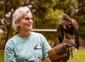 Gualaceo, Ecuador / June 1, 2018: A woman holds a bird of prey a