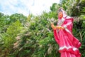 Guan yin statue with golden pagoda and tree background Royalty Free Stock Photo