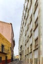 A narrow uphill street next to the University of Guanajuato