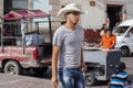 Image of daily life in the largest square in Guanajuato with a boy wearing the typical hat