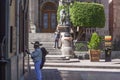 Panoramic view of a downtown street of Guanajuato with a mariachi singing Royalty Free Stock Photo