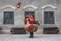 GUANGZHOU, CHINA Ã¢â¬â CIRCA JUNE 2020: Street vendor in Guangzhou dressed up as a colorful rooster.