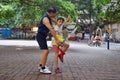 GUANGZHOU, CHINA - CIRCA MAY 2020: A little white girl practises kung-fu with a Chinese martial arts teacher