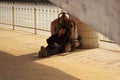 Guangzhou, China - MARCH 15, 2016: Homeless man sleeping near the road Royalty Free Stock Photo