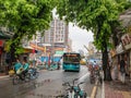 Guangzhou city traffic on the road beside people walking on the sidewalk at guangzhou china Royalty Free Stock Photo