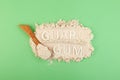 Guar gum powder or guarana in wooden spoon, top view. Inscription GUAR GUM. Design element. Food additive E412. Fat Replacer,