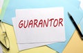 GUARANTOR text on paper on the colorful paper background