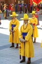 Guard change ceremony at the Deoksugung Royal Palace. Musicians in yellow clothes