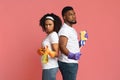 On Guard Of Cleanliness. Serious Black Couple Posing With Cleaning Supplies