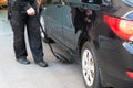The guard examines the bottom of car with a mirror Royalty Free Stock Photo