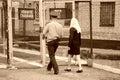 The guard leads the female prisoner to the visiting room Royalty Free Stock Photo