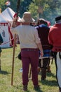 Guard with Pole Weapon and Straw Hat during Medieval Event Fair