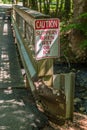 Guard rail on bridge with signage Royalty Free Stock Photo