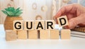 Guard - word on wooden cubes