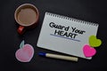 Guard Your Heart write on a book on office desk. Christian faith concept