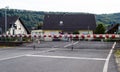 A guarded railway crossing with closed barriers. Royalty Free Stock Photo