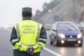 Guardia Civil officer next to a speed control monitors traffic Royalty Free Stock Photo