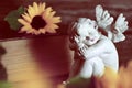 Guardian angel figurine and sunflowers Royalty Free Stock Photo