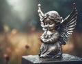 Guardian angel on the grave, blurred background, copy space Royalty Free Stock Photo