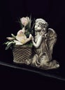 Guardian angel grave ornament. Angel and flowers on grave Royalty Free Stock Photo