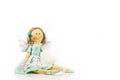 Guardian angel: isolated handmade doll with a white heart in her Royalty Free Stock Photo