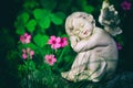 Guardian angel and pink flowers Royalty Free Stock Photo