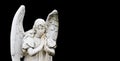 Guardian angel sculpture with open wings on wide panorama banner black background with empty text space. Angel sad.