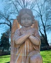 Guardian angel statue illuminated from the sunlight