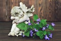 Guardian angel and violets Royalty Free Stock Photo