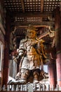 The guardian of Buddha statue (Komokuten) at the Great Buddha Hall of Todaiji Temple, Nara, Japan