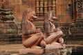 The guardian lions on the step to the sanctuary with the blind window at Banteay Srei Pink Sandstone Temple Royalty Free Stock Photo