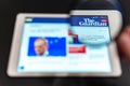 The Guardian News website homepage on the tablet screen. Guardian News channel logo Royalty Free Stock Photo