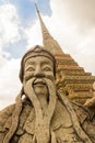 Guardian statue and stupa in Wat Pho, Bangkok, Thailand