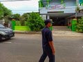 Guardian of the Streets: Security Officer Patrolling Alongside the Highway