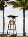 Guardian tower on the sea beach and palm trees Royalty Free Stock Photo