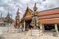 Guardians at the entrance to Temple of the Emerald Buddha Royalty Free Stock Photo