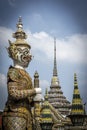 Guardians at the entrance to Temple of the Emerald Buddha