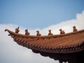 Guardians on Traditional Tiled Rooftop in China Royalty Free Stock Photo