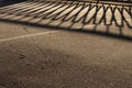 Guardrail Shadow on Icy Asphalt Road Surface Royalty Free Stock Photo