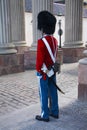 The guards of honour in red galla uniform guarding the Royal residence Amalienborg Palace in Copenhagen, Denmark.