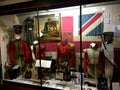 Inside the Guards Museum of London, exhibits of uniforms and weapons