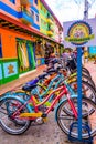 GUATAPE, COLOMBIA - OCTOBER 19, 2017: Close up of bikes parked in a row in a beautiful colorful streets and decorated