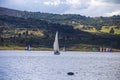 Beautiful shot for a cool day view at the small boat sailing in lake in Guatavita, Colombia